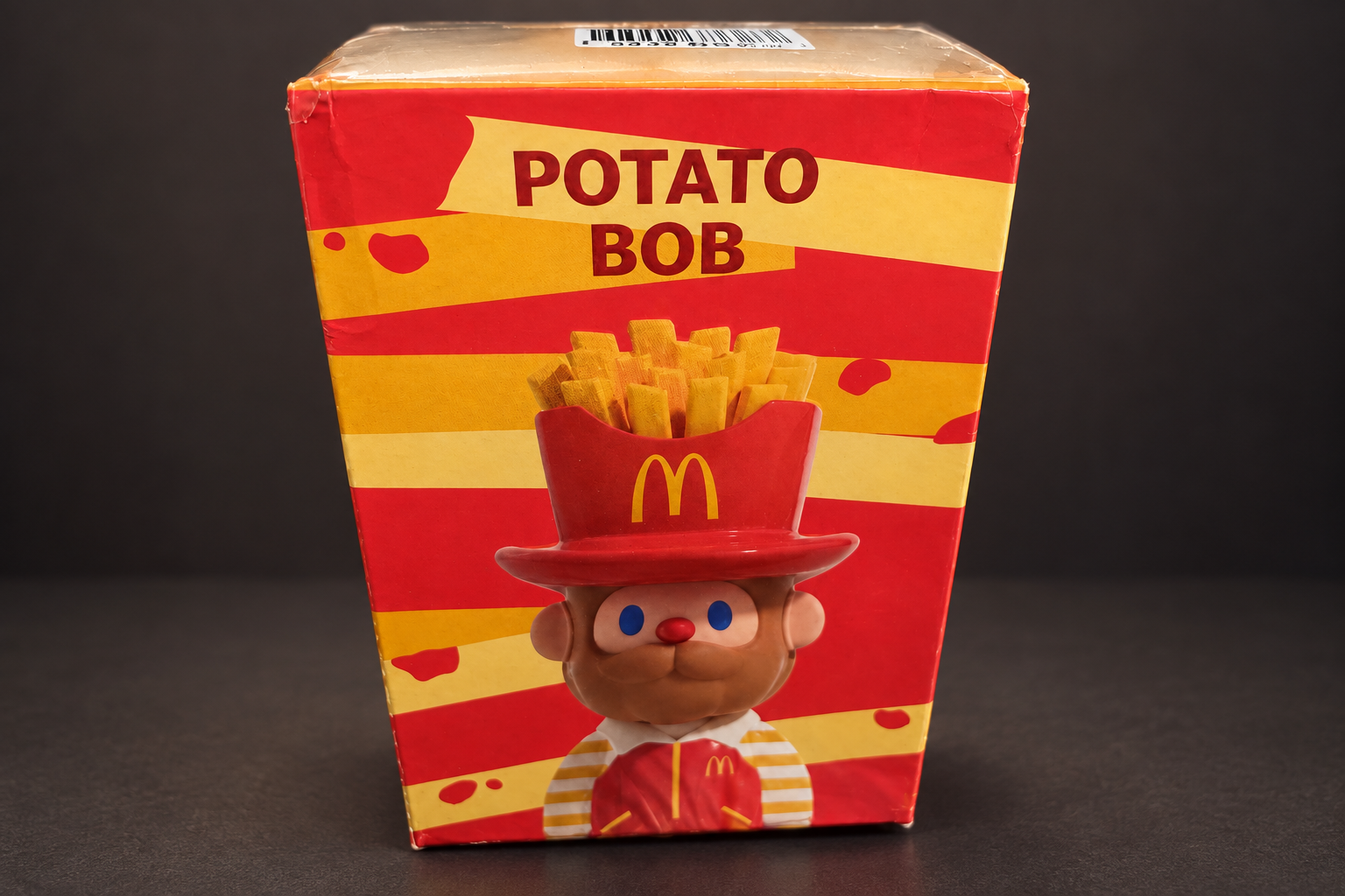 The red and yellow POTATO BOB box from the McDonald's × FARMER BOB figure series
