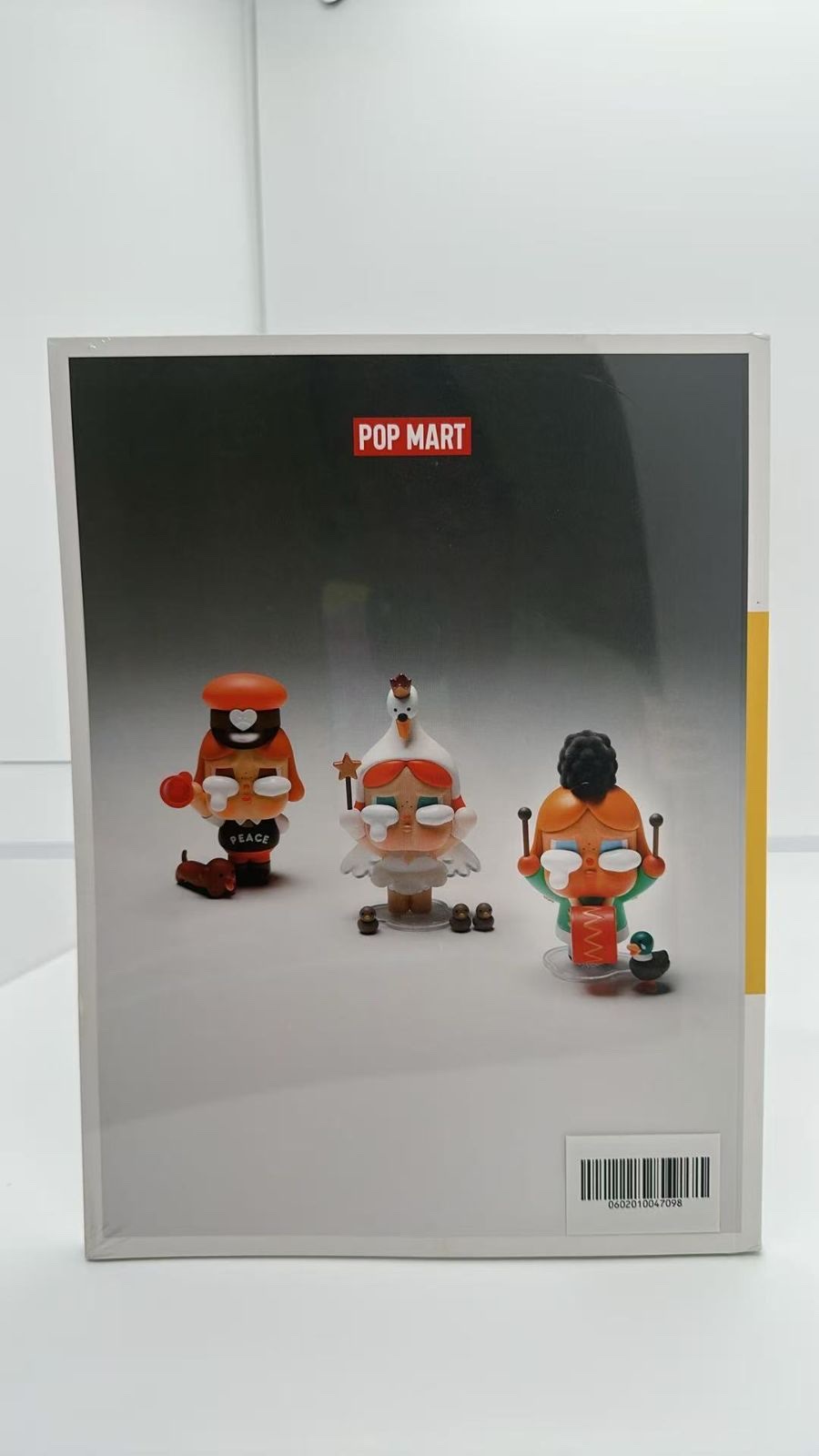 Back cover of PLAYGROUND VOL.07, with the POP MART logo, a photo of three figures and a barcode sticker at lower right