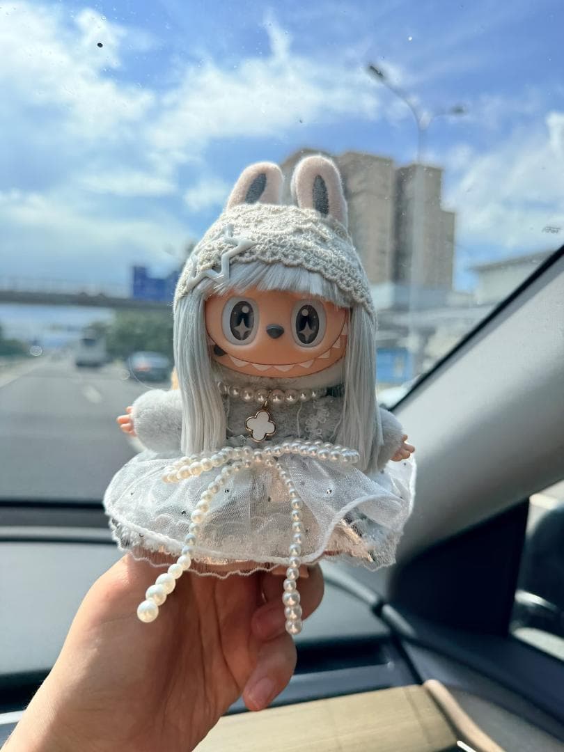 Unedited listing photo of a hand holding a LABUBU wearing the outfit